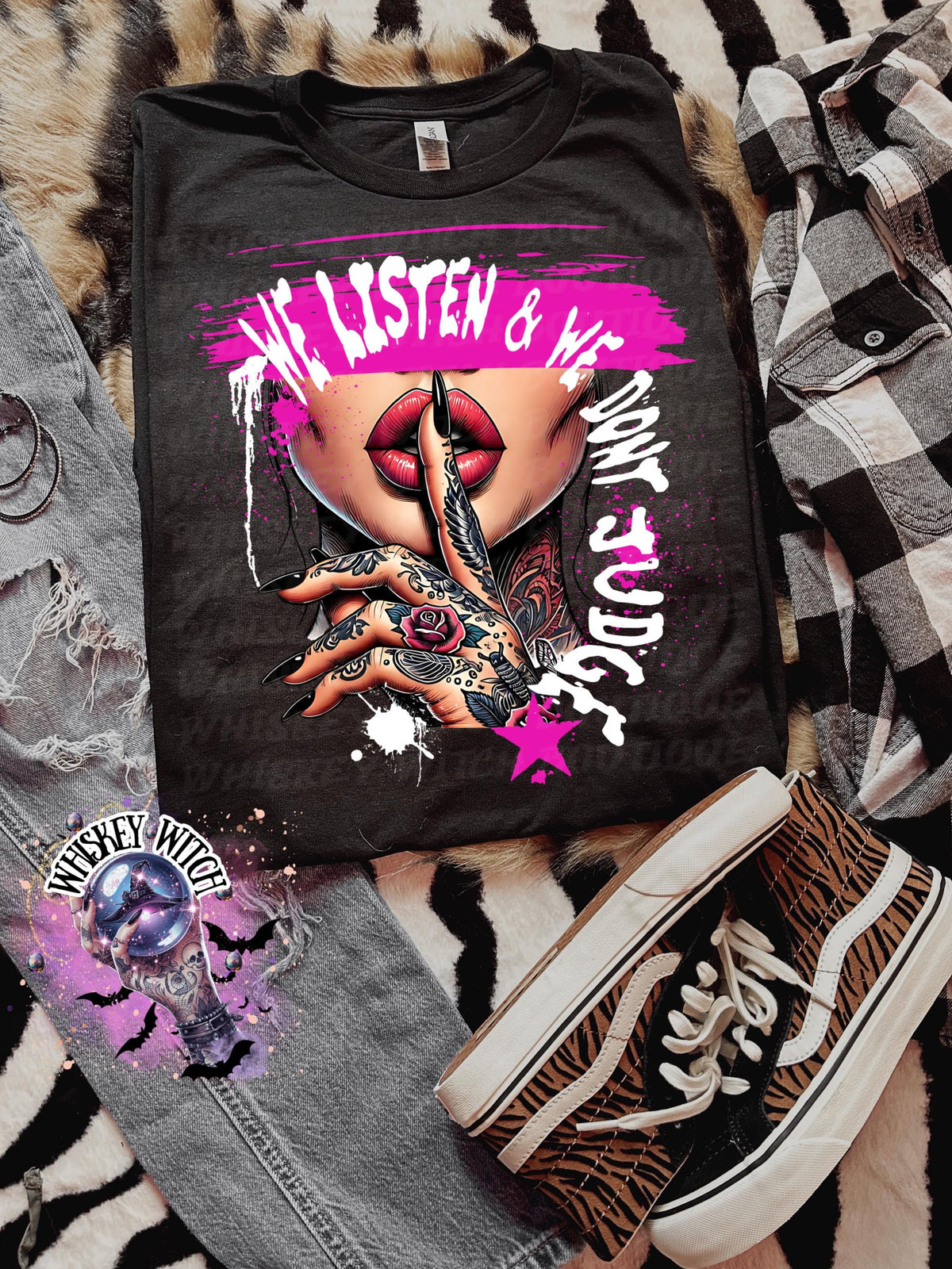 Black unisex sweatshirt with ‘We Listen & We Don’t Judge’ pink lips and shhh hand graphic.