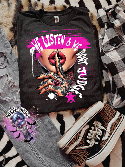 Black unisex sweatshirt with ‘We Listen & We Don’t Judge’ pink lips and shhh hand graphic.