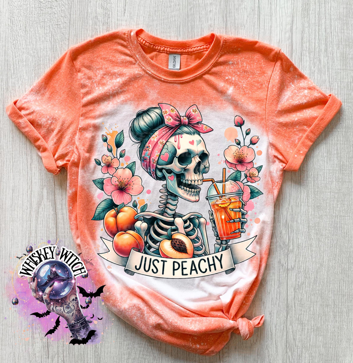 Orange tie-dye t-shirt with a skeleton wearing a pink headband and drinking a peach drink. The shirt has the text "Just Peachy" printed on it.  Hand Bleached Peach Tee, Spooky Cute Summer Graphic T-Shirt, Gildan Unisex