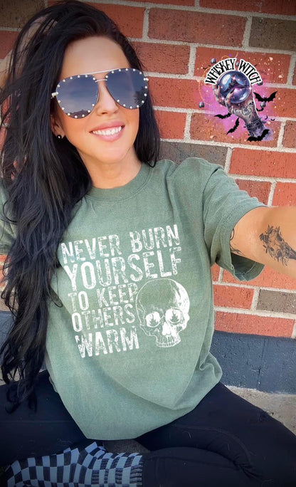 Close-up of white ink skull and rough text on self-care boundaries shirt