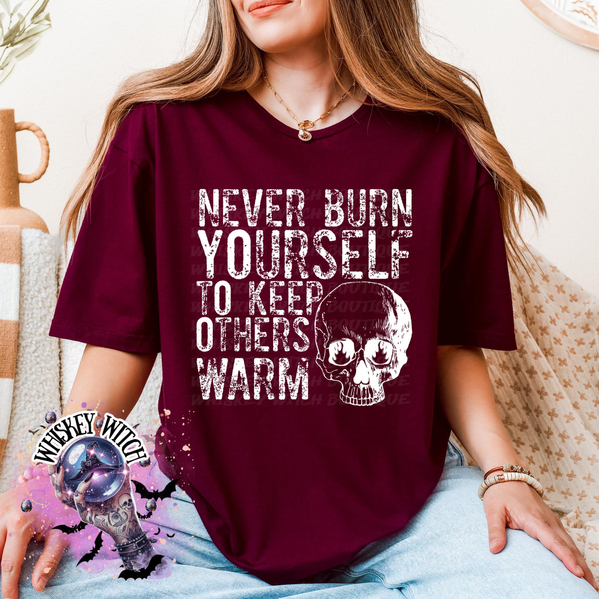 Close-up of white ink skull and rough text on self-care boundaries shirt