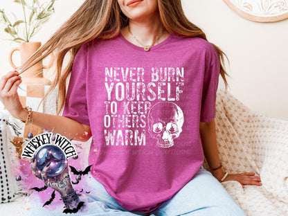 Close-up of white ink skull and rough text on self-care boundaries shirt