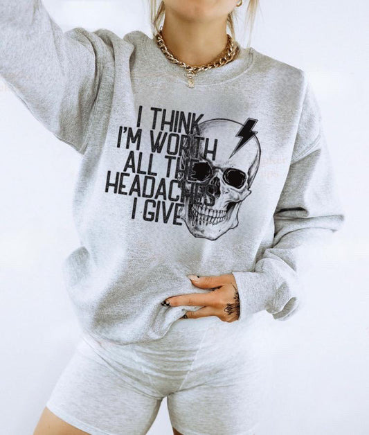 Heather gray unisex crewneck with ‘I think I’m worth all the headaches I give’ skull graphic
