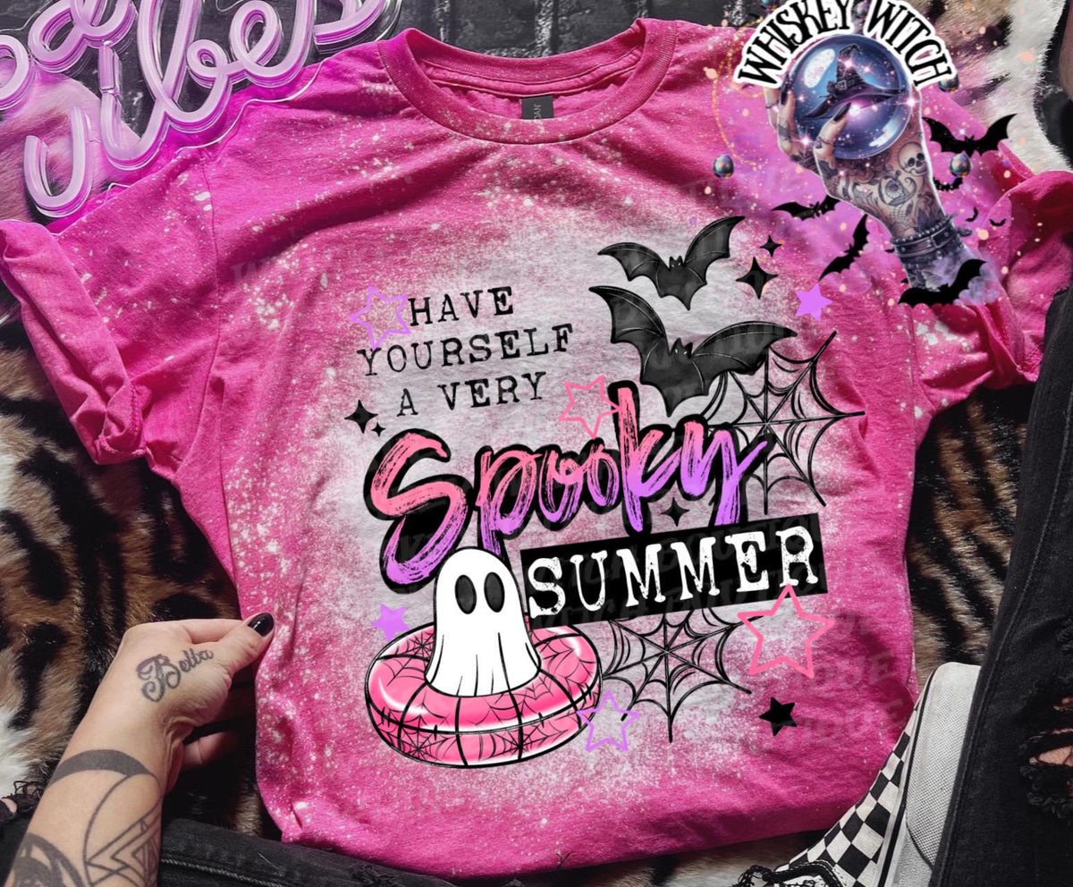 Cute ghost pool float graphic shirt with pink, black, and white summerween design details.
Pink bleached