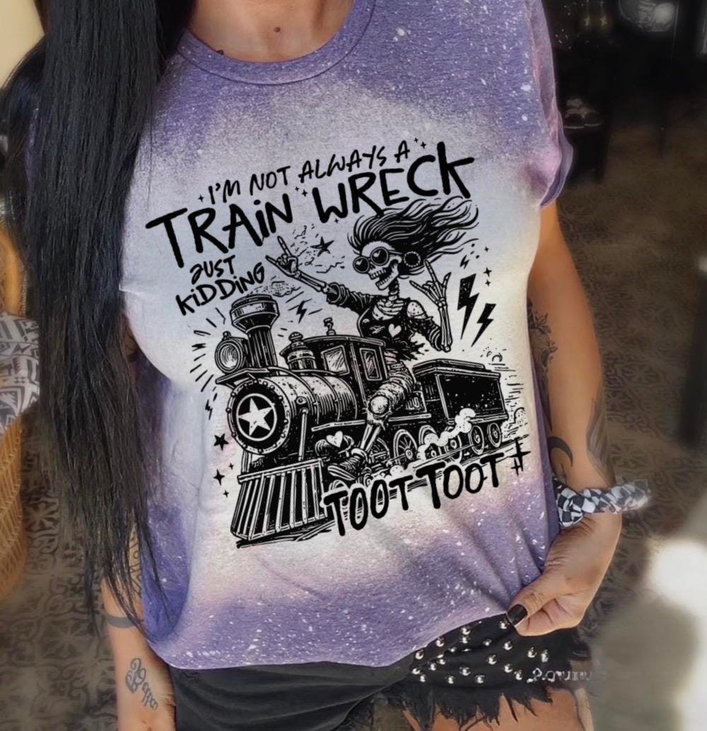 Bleached handmade graphic T-shirt with funny train wreck skeleton design and black text that says I’m not always a train wreck just kidding toot toot.